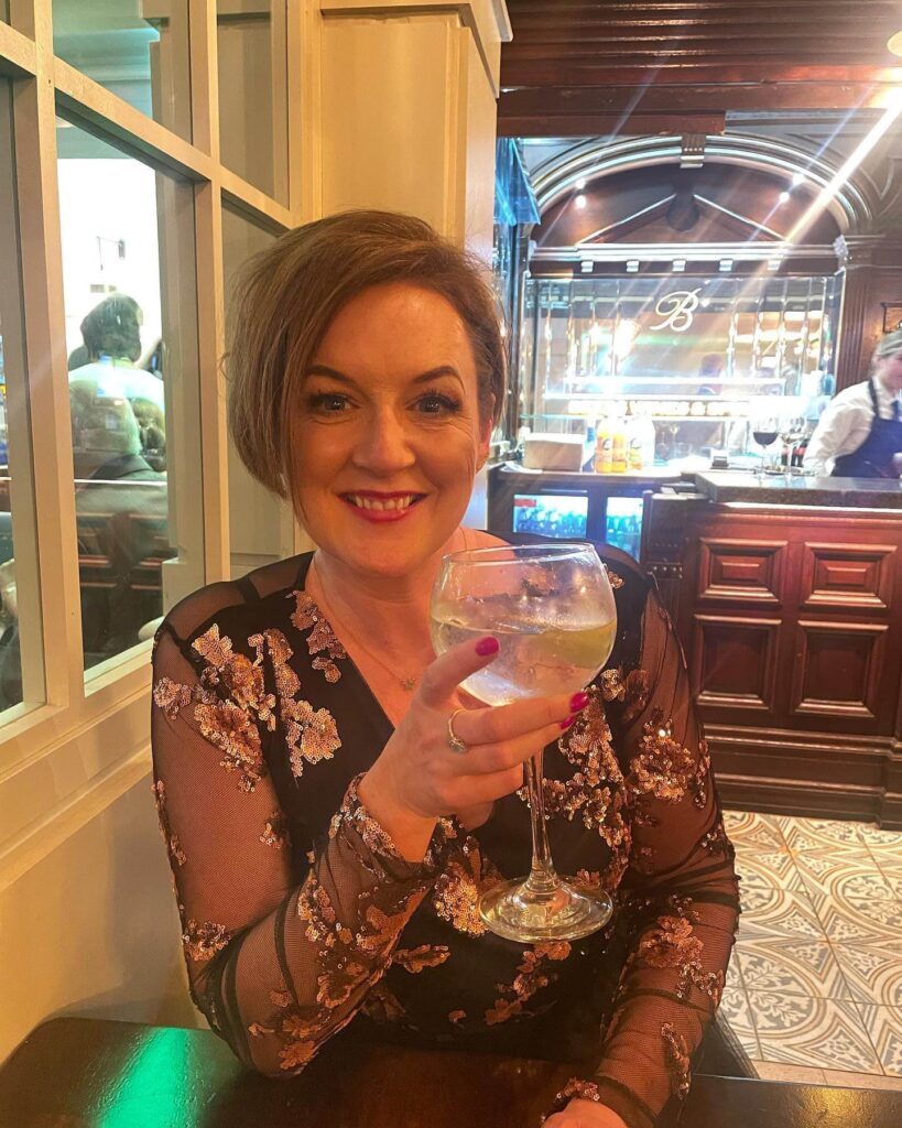 Larissa Feeney drinking wine