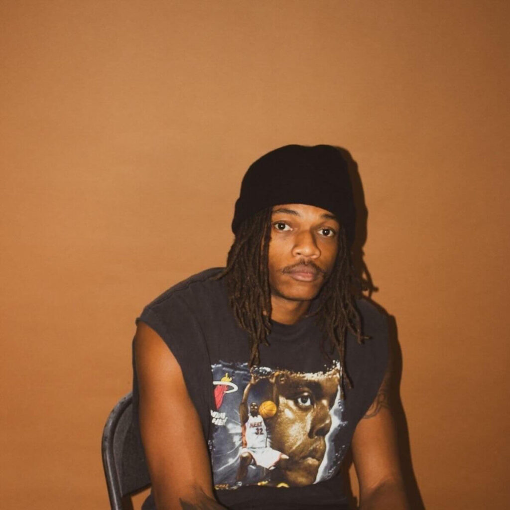 Rico Ace sitting on chair