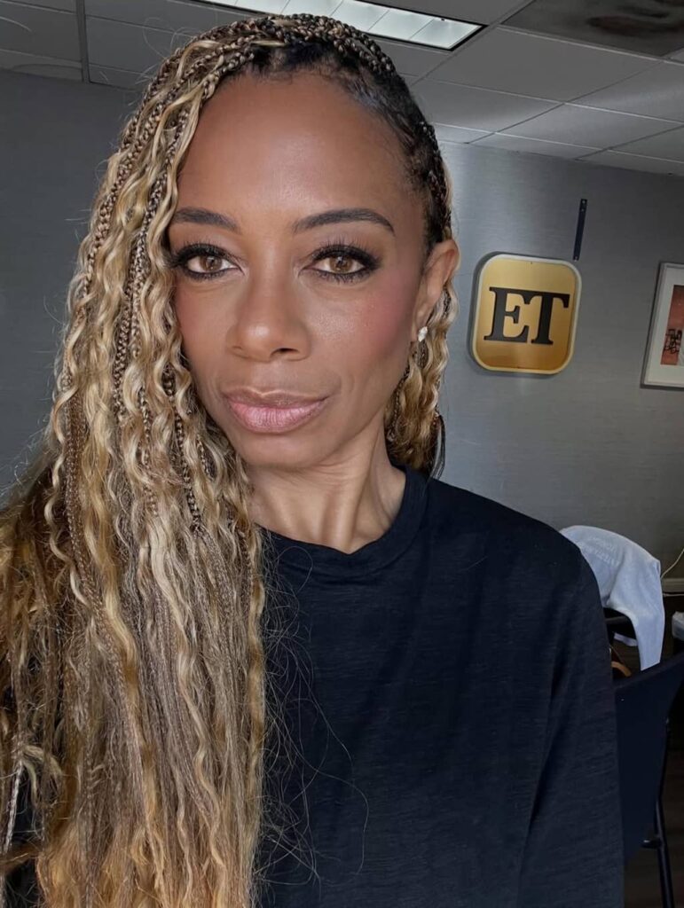 Nischelle Turner with curly hair
