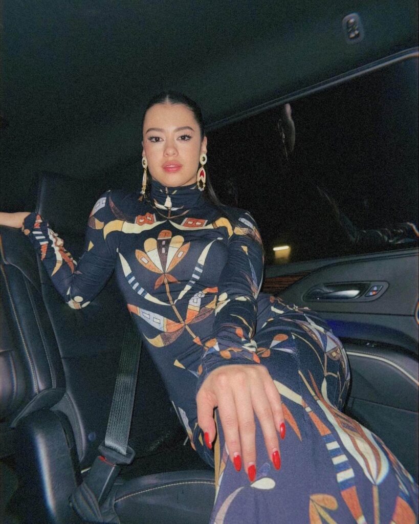 Amber Midthunder sitting in car