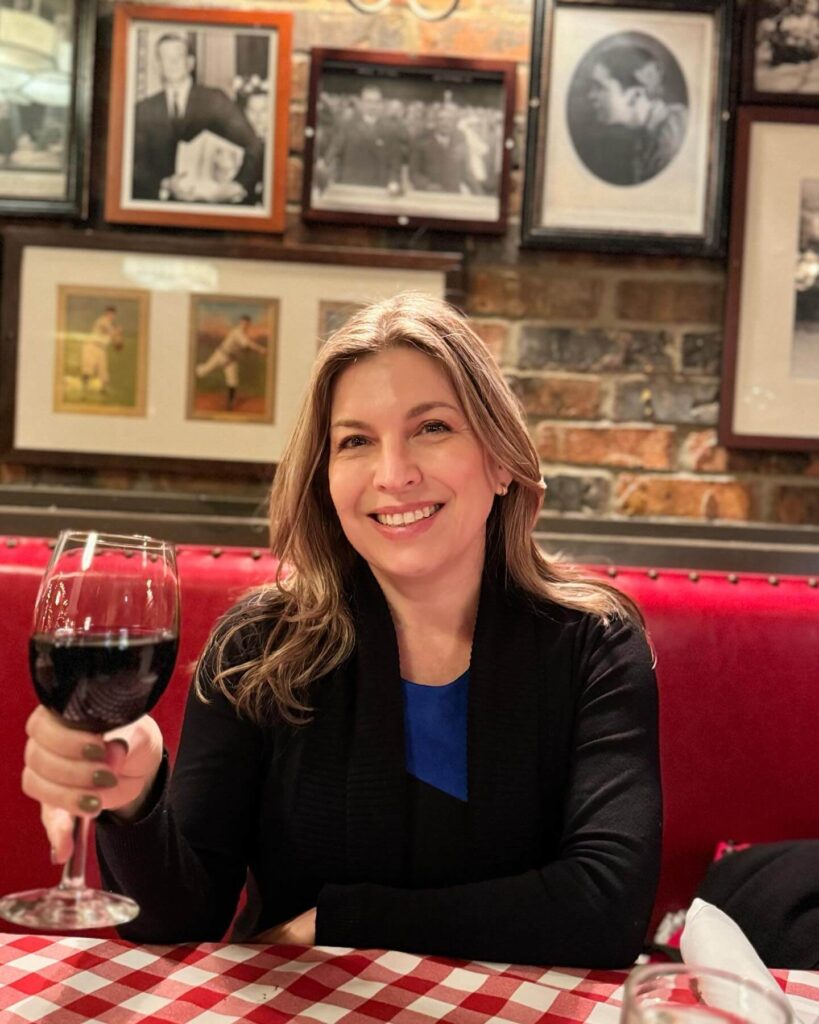 Paola Elorza drinking wine